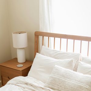 A bed made with linen