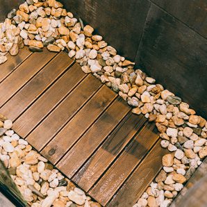 A teak bath mat