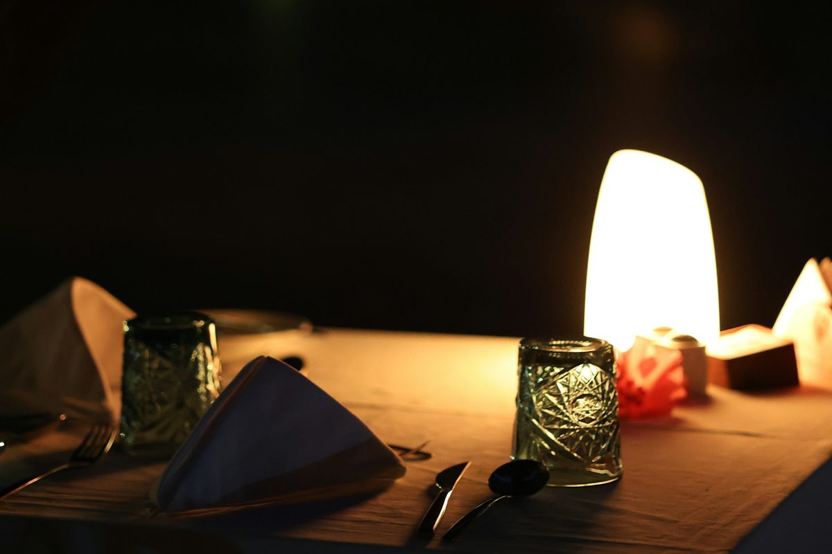 A candlelit table set for two