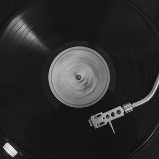 A black record spinning on a turntable