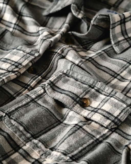 Close-up of a gray and white flannel shirt