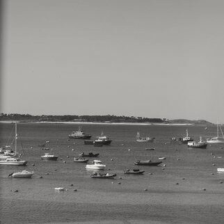 Small boats moored in a calm bay