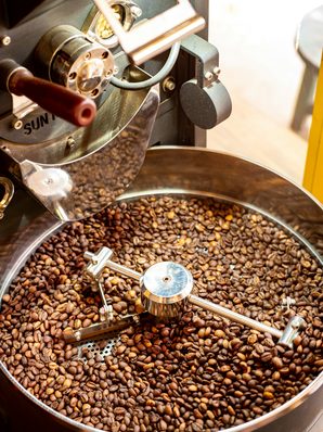 Freshly roasted beans turning in a roaster drum