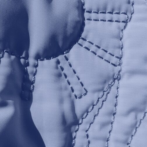 Close-up of quilted jacket fabric and its stitching