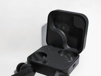 Wireless earbuds in an open charging case