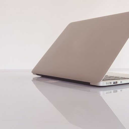 The back of a closed laptop on a white background