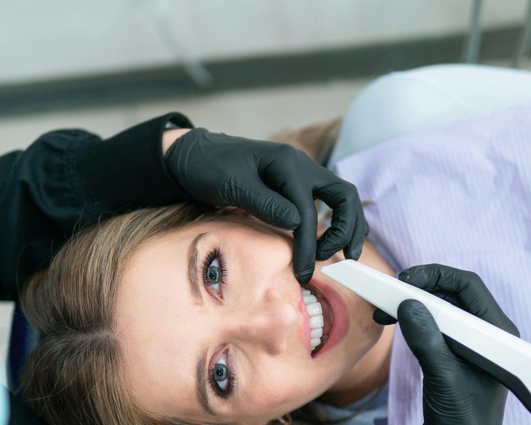 A smiling patient in the dental chair