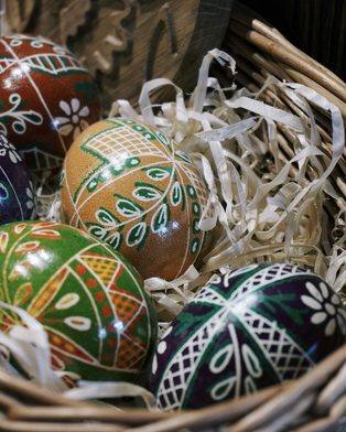 A wicker basket of hand-painted eggs