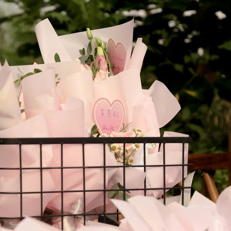A basket of pink wrapped treats