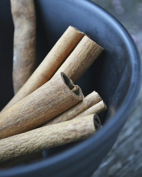 Cinnamon sticks in a blue bowl