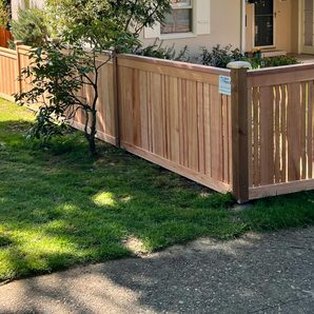A new cedar fence along a front yard