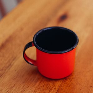 A red enamel mug