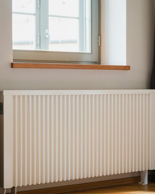 A white radiator under a window