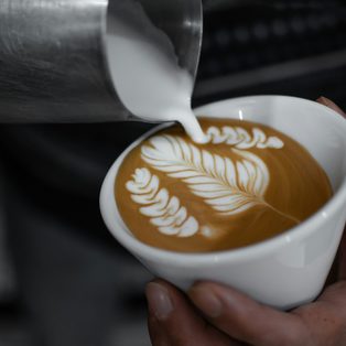 A finished rosetta in a white cup