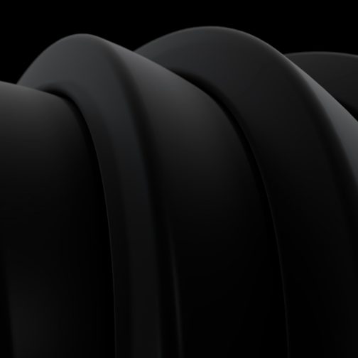 Coils of matte black material against a dark background