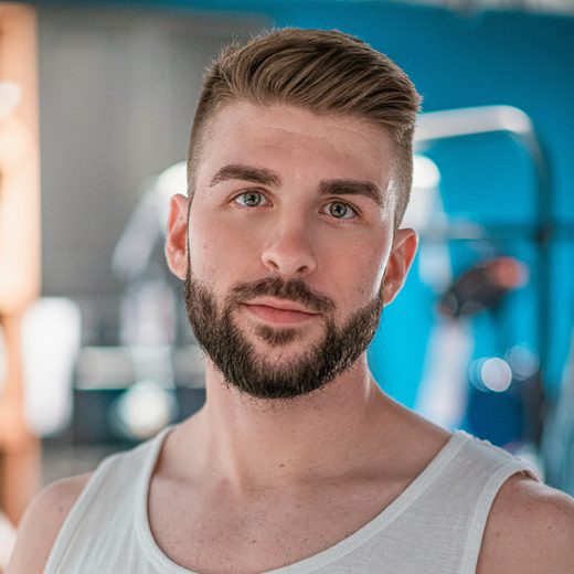 Marcus, in a white tank top