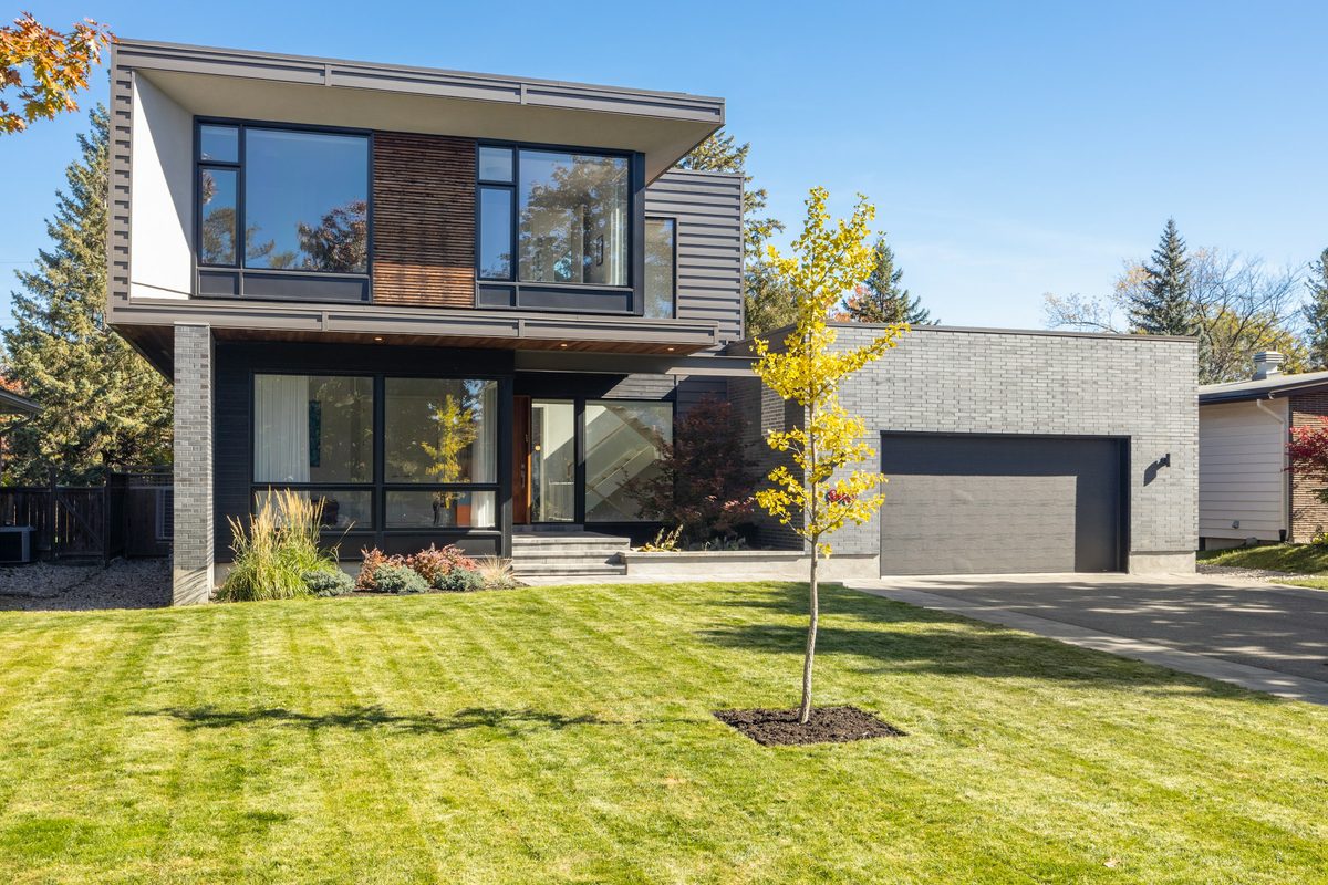 412 Sycamore Lane, a modern two-story house behind a green lawn