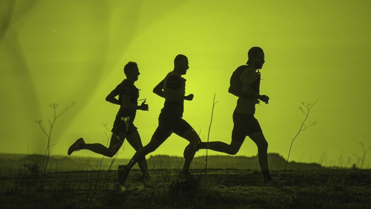 Runners on the ridge road at sunrise