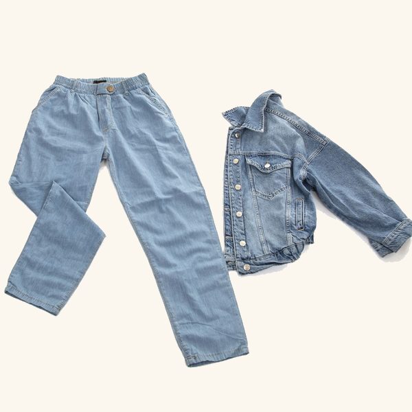 A pair of light wash jeans and a matching denim jacket