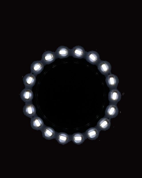 A ring of small lights glowing in the dark
