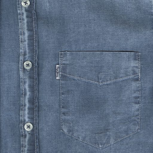 Close view of a chambray shirt's buttons and chest pocket