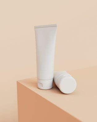 A plain white tube of sunscreen on a peach block