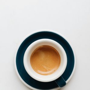 A stoneware espresso cup and saucer
