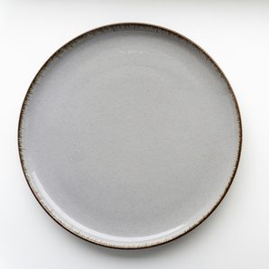 A white stoneware side plate