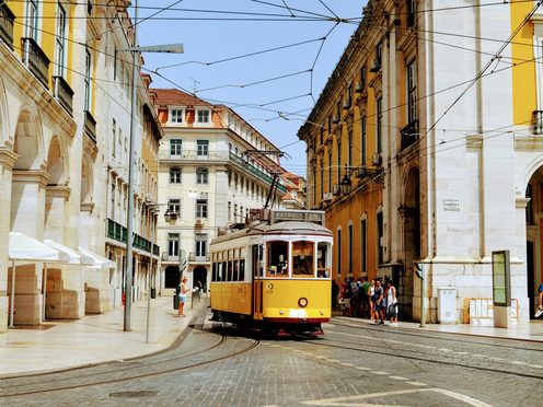 A tram on a tiled Lisbon street